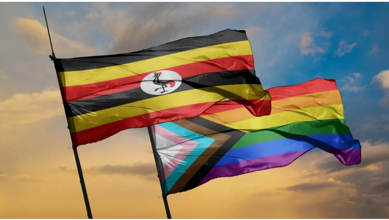 The Ugandan national flag alongside a Progress Pride flag against a warm sky